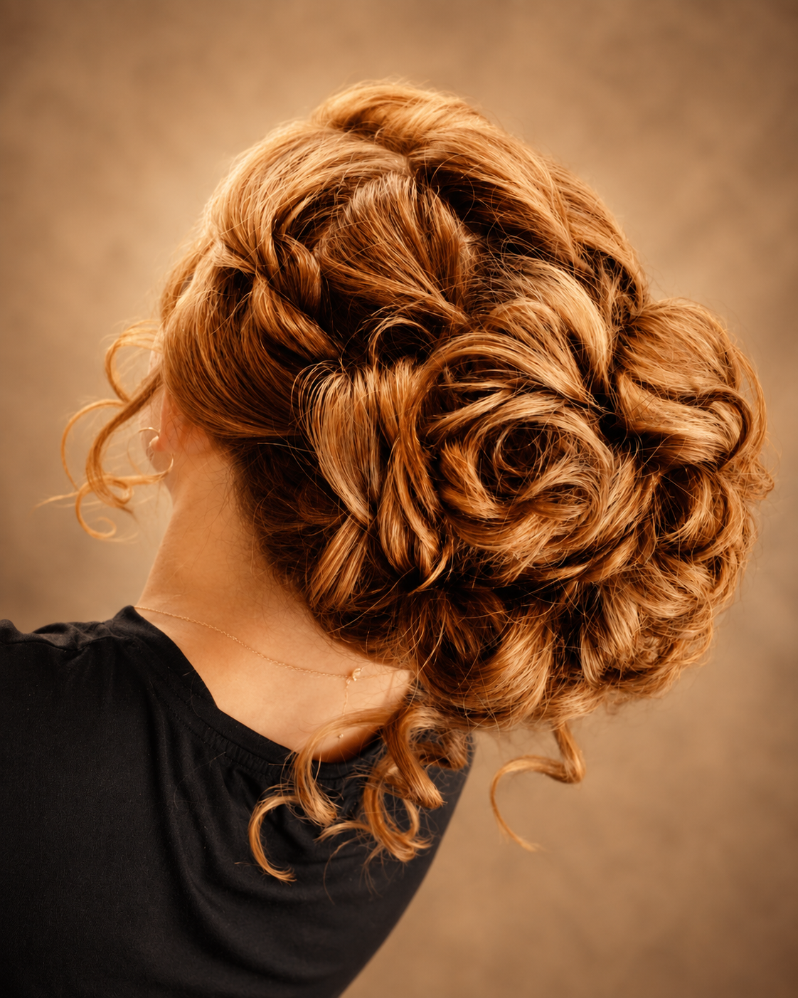 Textured curly copper-blonde occasion updo
